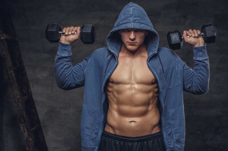 Man lifting weights to build muscle.